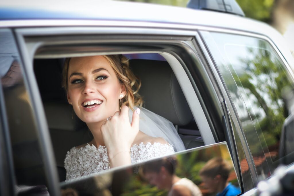 bride in wedding car